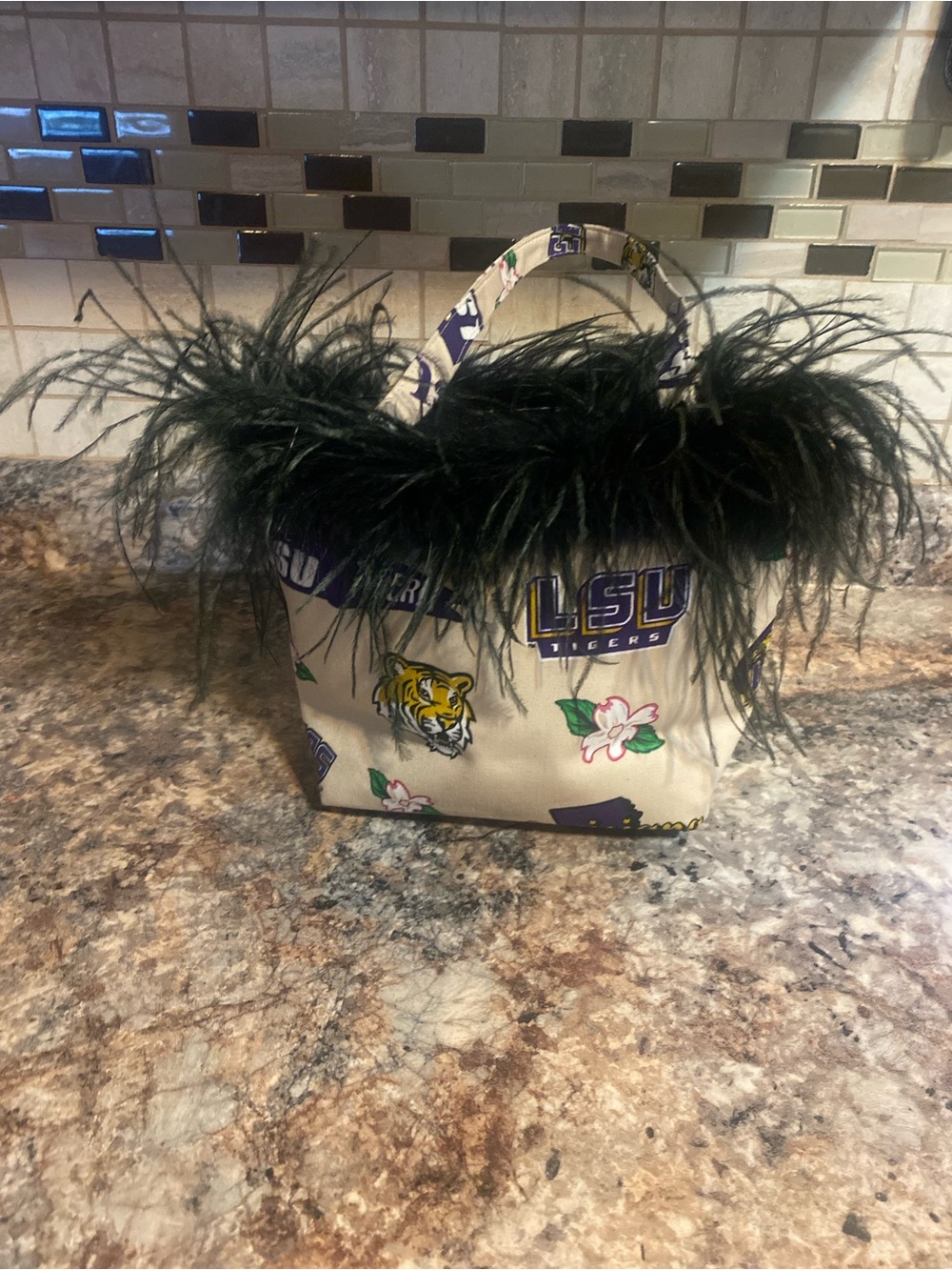 LSU new without tags canvas tote with black feathers at the top